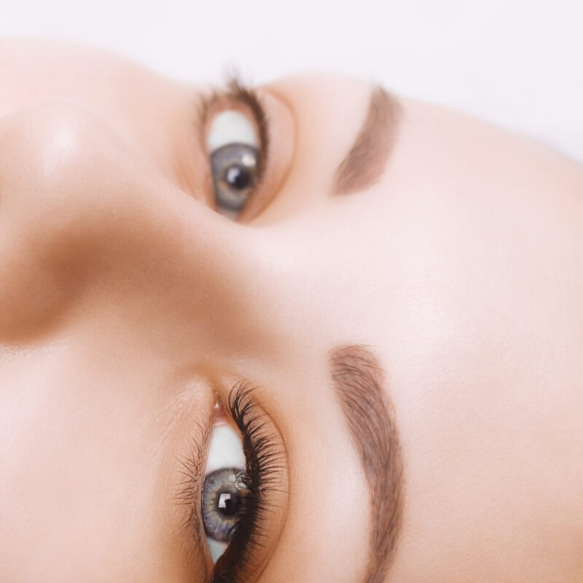 Eyelash Extension Procedure. Woman Eye with Long Eyelashes. Lashes. Close up, macro, selective focus